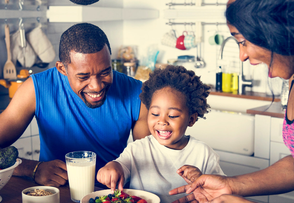 couple with baby having breakfast