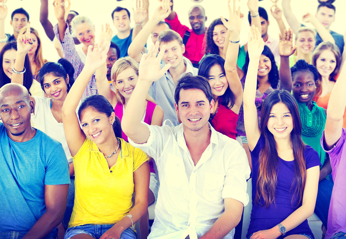 group of people raising their right hand